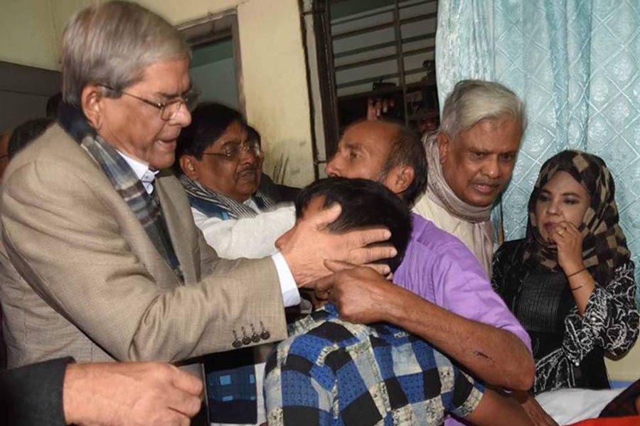 BNP secretary general Mirza Fakhrul Islam Alamgir consoling the family members of Subarnachar gang-rape victim at Noakhali General Hospital on Saturday. Photo: UNB