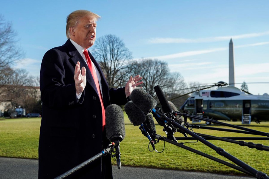 US President Donald Trump speaks to the media as he returns from Camp David to the White House in Washington, US, January 6, 2019. Reuters