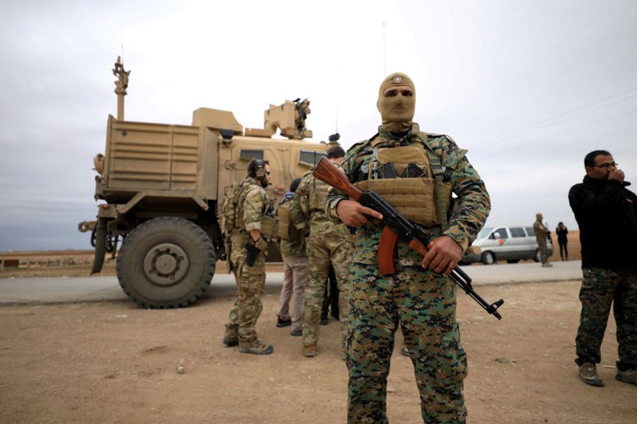 Syrian Democratic Forces and US troops are seen during a patrol near Turkish border in Hasakah, Syria, November 4, 2018 - Rodi Said/Reuters