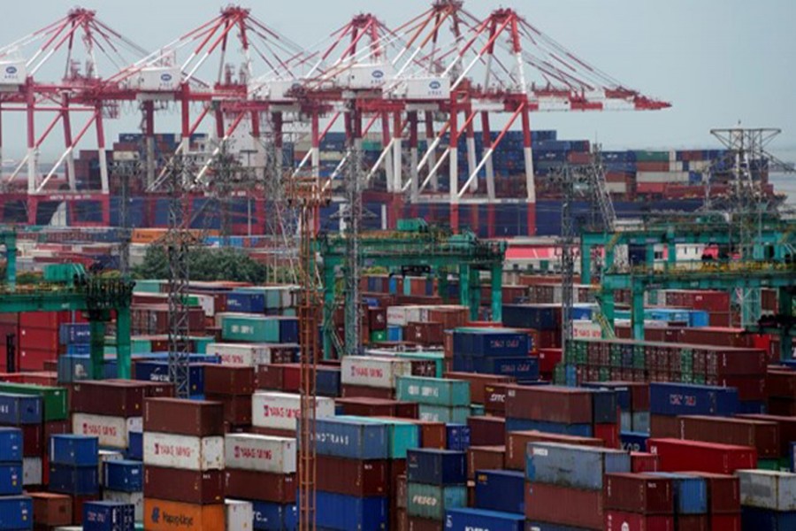 Shipping containers are seen at a port in Shanghai, China July 10, 2018. Reuters/Files