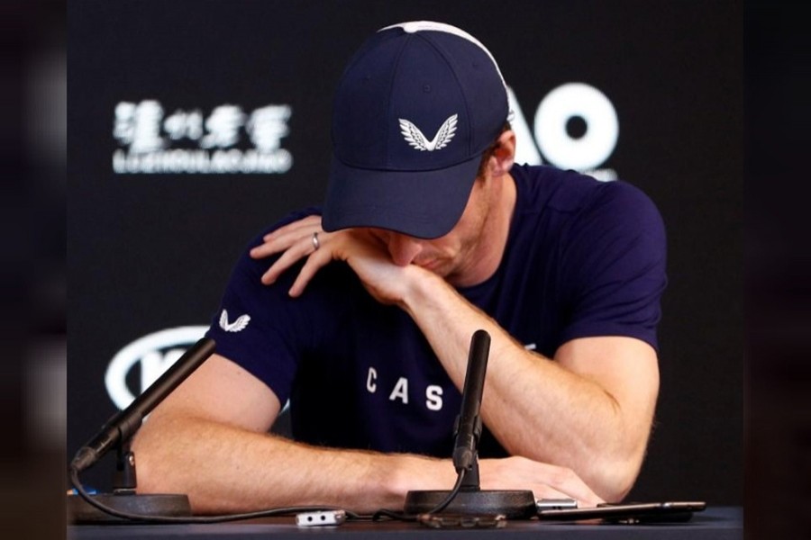 Britain's Andy Murray tries to hide his tears during a press conference as he announces plans to retire in 2019 — AAP photo via Reuters