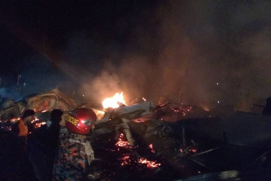 Shops are gutted in a fire at Elisha Junction Bazar in Bhola sadar upazila on Saturday night — UNB photo