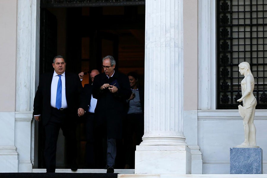 Greek Defence Minister and coalition partner Panos Kammenos leaving the Maximos Mansion following a meeting with Greek Prime Minister Alexis Tsipras in Athens of Greece on Sunday. -Reuters Photo