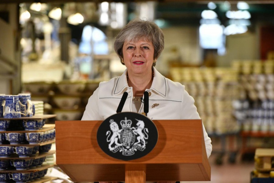 British Prime Minister Theresa May speaks during a visit to the Portmeirion factory in Stoke-on-Trent, Britain, January 14, 2019. Reuters