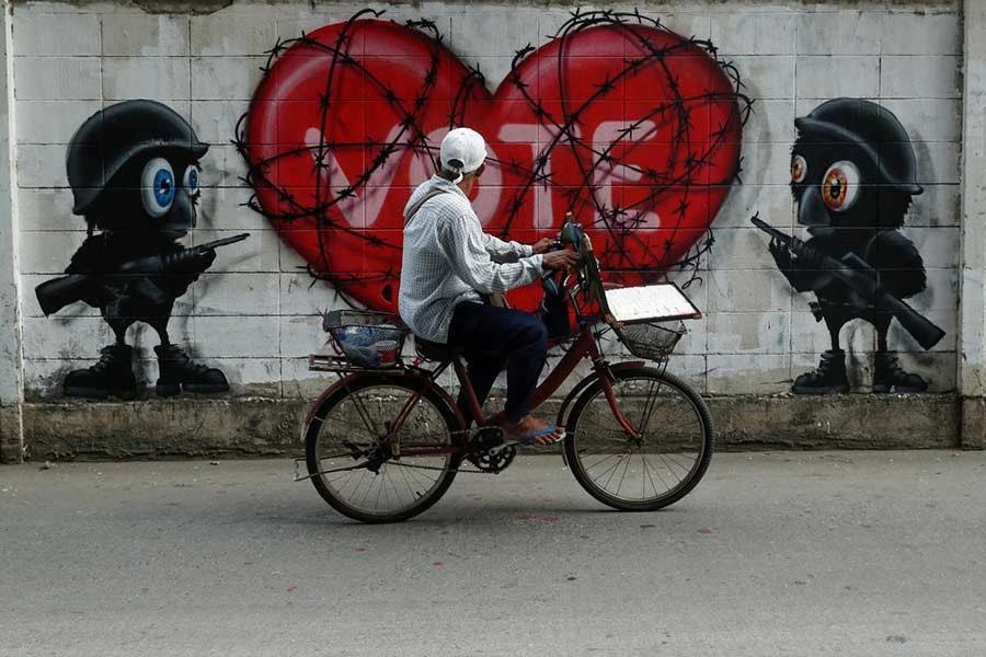 The photo shows a graffiti on election is seen on a wall in Bangkok of Thailand.