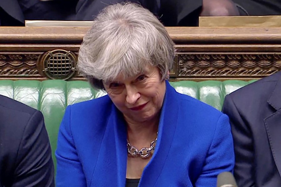 British Prime Minister Theresa May reacts as Jeremy Corbyn speaks, after she won a confidence vote, after Parliament rejected her Brexit deal, in London, Britain on Wednesday in this screengrab taken from video — Reuters TV via Reuters
