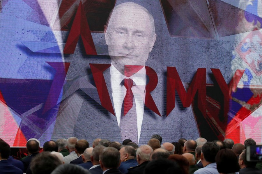 Russian President Vladimir Putin addresses participants via a video link during the opening of the annual international military-technical forum "ARMY" at Patriot Expocentre in Moscow Region, Russia August 21, 2018. - Reuters