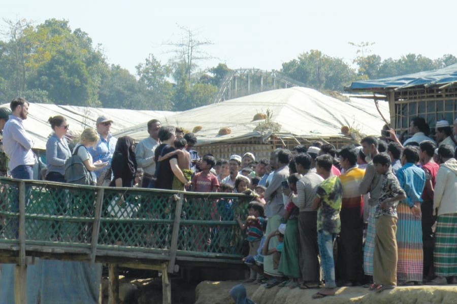 Yanghee Lee, the UN Special Rapporteur (at the centre holding a child), visited UNHCR transit centre at Kutupalong of Ukhiya in Cox's Bazar on Sunday, January 21 and talked to Rohingyas staying there. —Photo: UNB