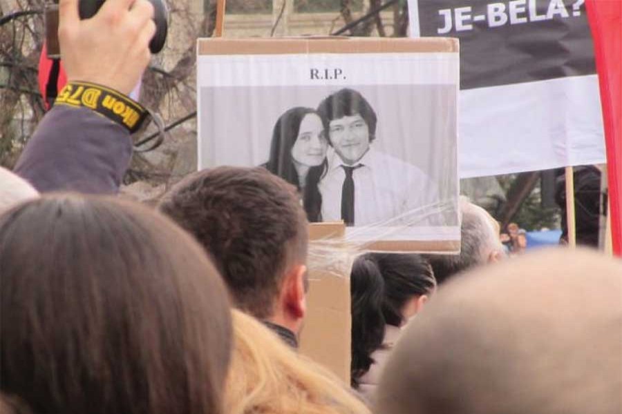 A protester in the Slovak capital, Bratislava holds up a picture of murdered journalist Jan Kuciak and his fiancée Martina Kusnirova. 	—Ed Holt/IPS