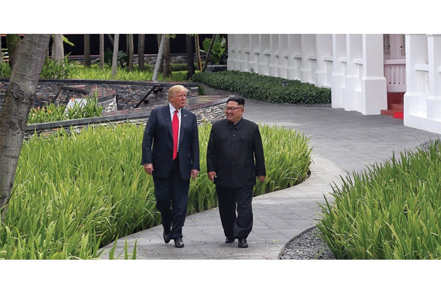 US President Donald Trump walks with North Korean leader Kim Jong Un at the Capella Hotel on Sentosa island in Singapore on June 12, 2018.            —Photo: Reuters