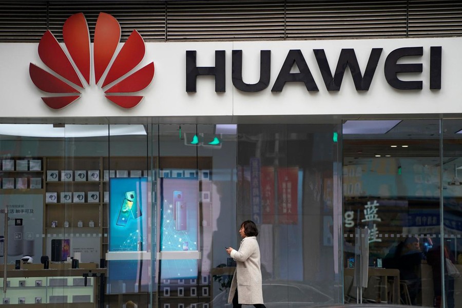 A man walks by a Huawei logo at a shopping mall in Shanghai, China, December 6, 2018. Reuters/Files