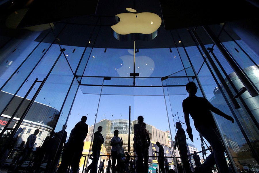 Customers walk into an Apple Store after Apple's new iPhone XS and XS Max went on sale in Beijing, China on September 21, 2018 — Reuters/File