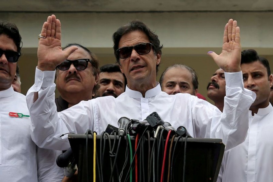 In this Reuters file photo, cricket star-turned-politician Imran Khan, chairman of Pakistan Tehreek-e-Insaf (PTI), speaks after voting in the general election in Islamabad.