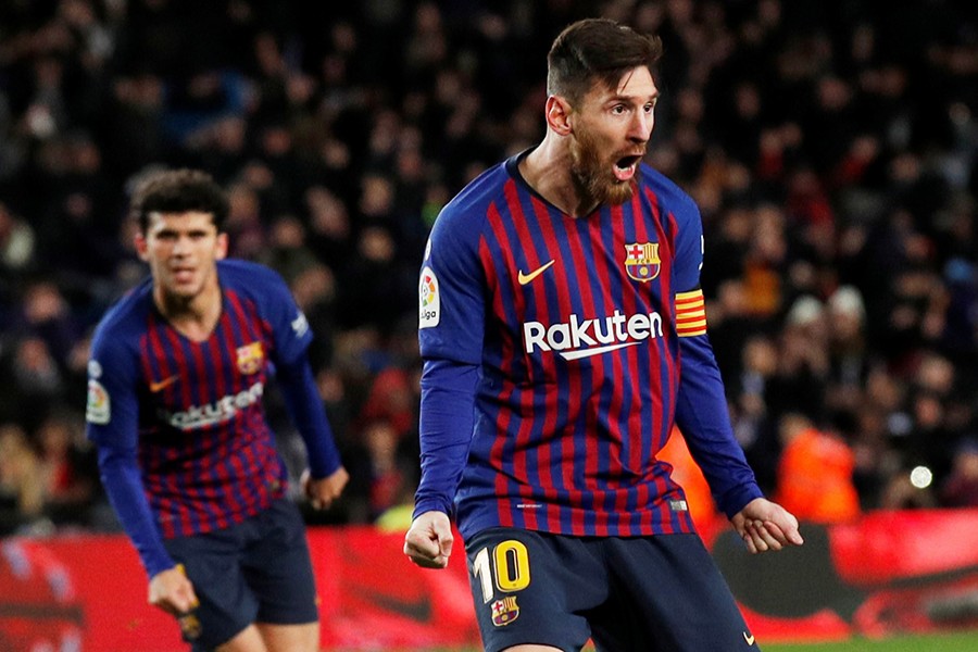 Lionel Messi celebrates after scoring a second to level the match for Barcelona — Reuters photo