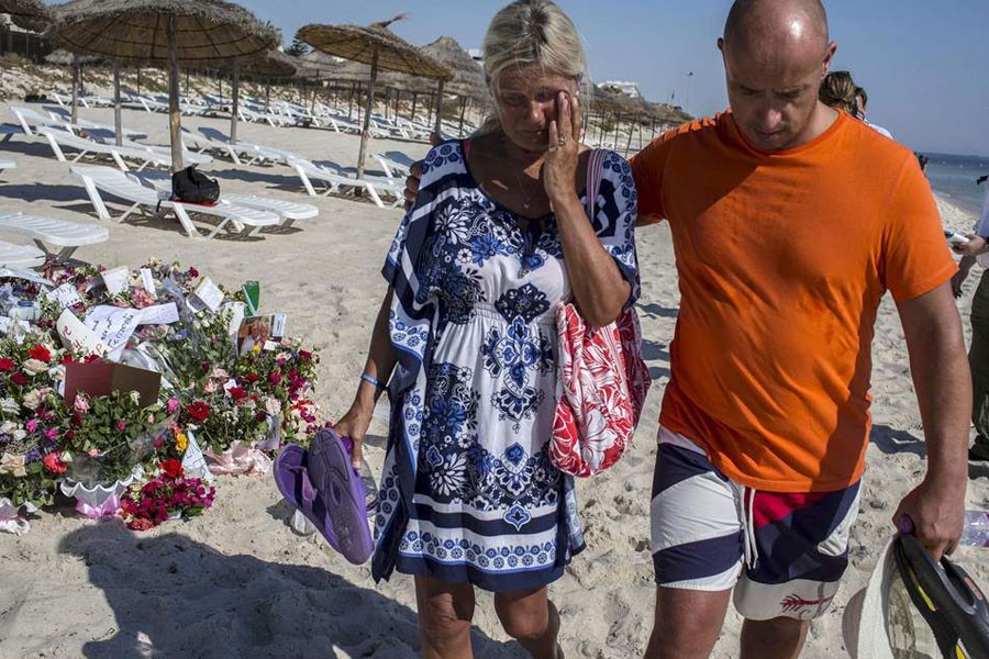 Tourists pay their respects in front of a makeshift memorial at the beach near the Imperial Marhaba resort in Sousse, Tunisia, which was attacked by a gunman in 2015 - Reuters file photo