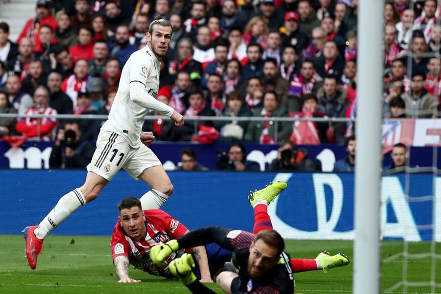 Bale scores his 100th goal for Real Madrid in derby win against Atletico — Reuters