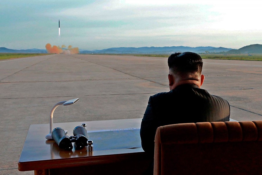 North Korean leader Kim Jong Un watches the launch of a Hwasong-12 missile in this undated photo released by North Korea's KCNA — Reuters/File