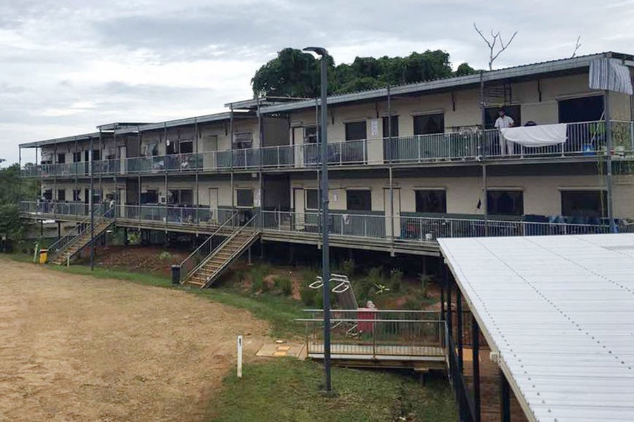 In this July 17, 2018 photo provided by Aziz Abdul, a man is seen standing on a balcony at the East Lorengau Refugee Transit Centre on Manus Island, Papua New Guinea - Aziz Abdul via AP