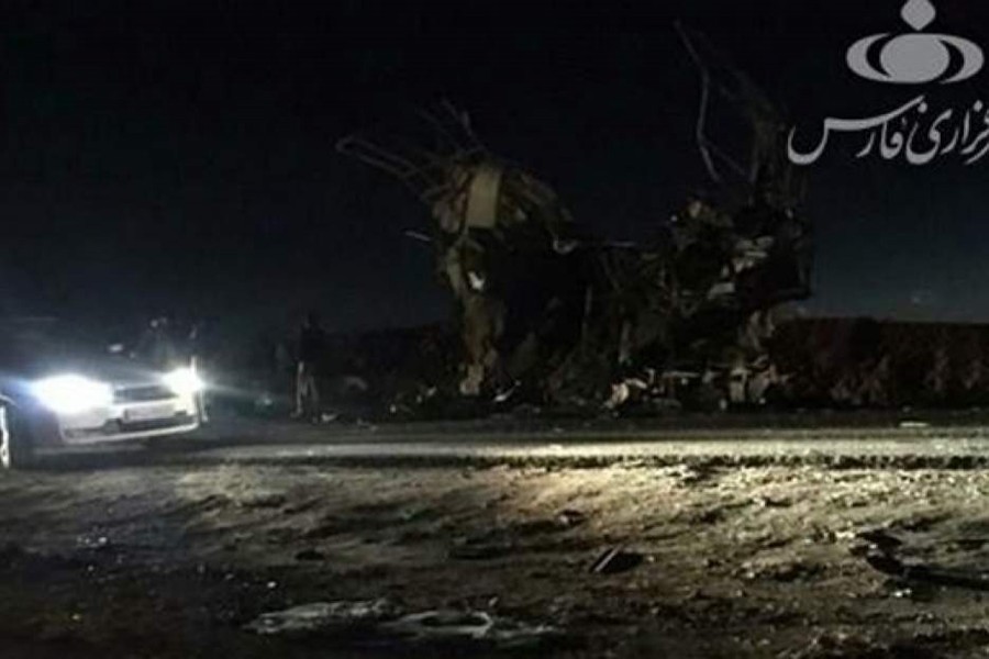 A car is seen at the site of the suicide attack on a Revolutionary Guards on the road between the cities of Zahedan and Khash, Iran on Wednesday — Fars News/Handout via Reuters