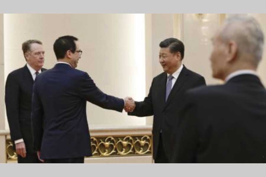 US Treasury Secretary Steven Mnuchin, second from left, shakes hands with Chinese President Xi Jinping as US. Trade Representative Robert Lighthizer, left, and Chinese Vice Premier Liu He, right, look on before their meeting at the Great Hall of the People in Beijing on February 15, 2019	— AP