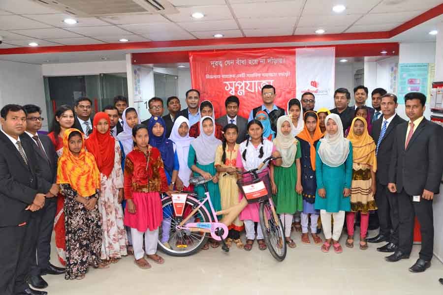 Midland Bank distributes bicycles among female students