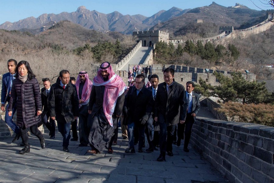 Saudi Arabia's Crown Prince Mohammed bin Salman walks with officials during his visit to Great Wall of China in Beijing, China, February 21, 2019. Courtesy of Saudi Royal Court/Handout via Reuters