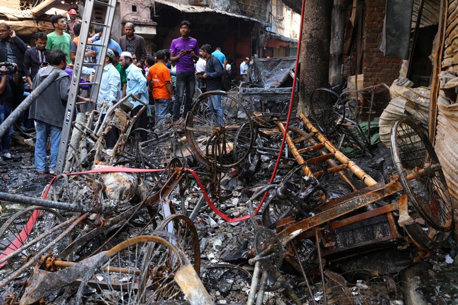 Debris are seen outside the burnt warehouse at Chawkbazar in Dhaka, February 21, 2019. Reuters