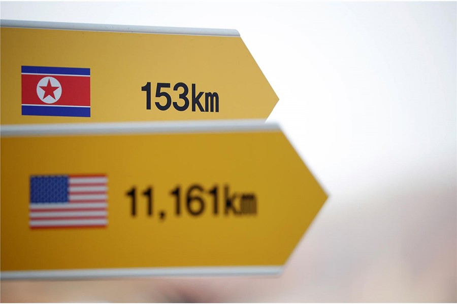 A directional sign bearing North Korean and US flags is seen near the demilitarised zone separating the two Koreas in Paju, South Korea on January 19, 2018 — Reuters/File