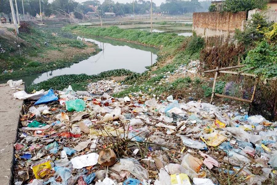 A pile of wastes near the Chilai river in Gazipur      	— UNB Photo