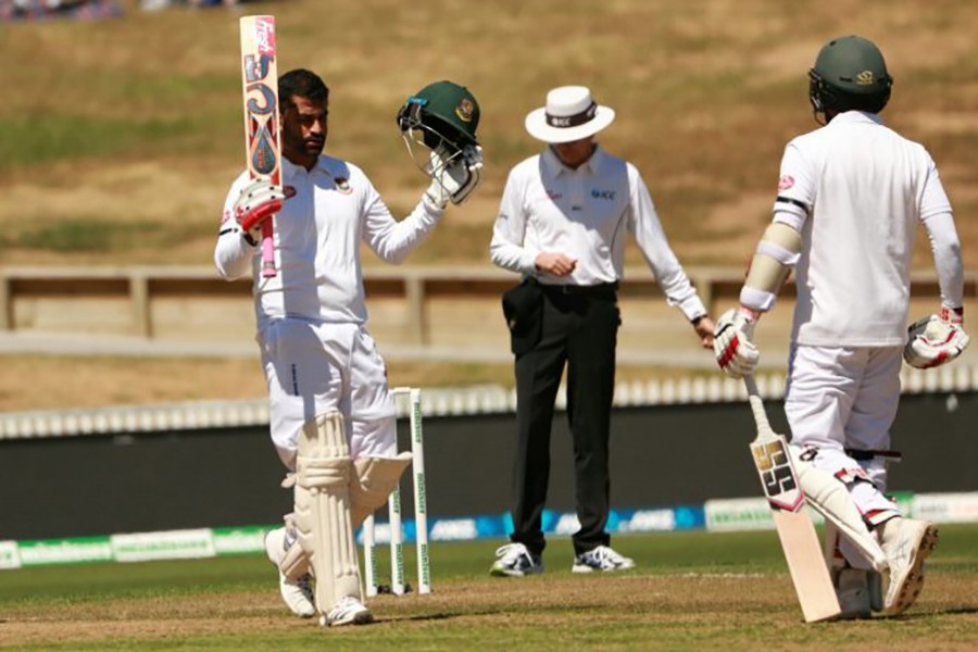 Bangladesh opener Tamim Iqbal acknowledges spectators by raising his bat after century against the Kiwis — Photo via BCB