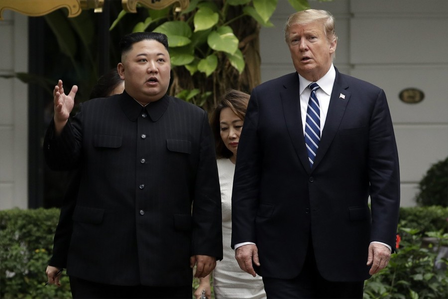 President Donald Trump and North Korean leader Kim Jong Un take a walk after their first meeting at the Sofitel Legend Metropole Hanoi hotel, Thursday, Feb 28, 2019, in Hanoi - AP Photo/Evan Vucci