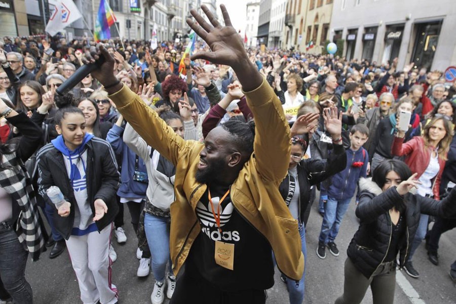 DJ Simon Samaki Osagie sings during an anti-racism demonstration, in Milan, Italy, Saturday, March 2, 2019 - AP Photo/Luca Bruno