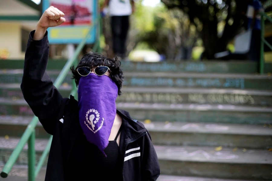 A masked demonstrator shouts slogans against Nicaraguan President Daniel Ortega's government during a protest to mark International Women's Day at Central American University (UCA) in Managua, Nicaragua March 8, 2019. Reuters/File Photo
