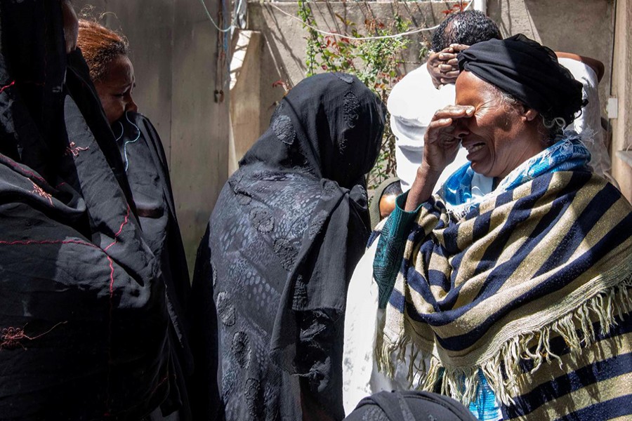 Relatives and friends of Sara Gebremichael, 38, a senior hostess and a crew leader on the Ethiopian Airlines Flight ET 302 plane that crashed, mourn at her house in Addis Ababa, Ethiopia on March 11, 2019 — Reuters photo