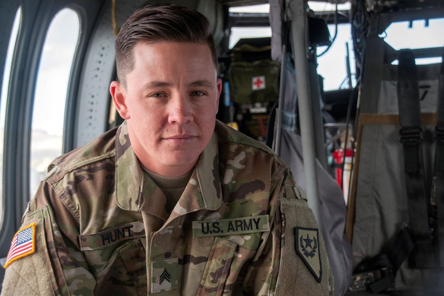 Nevada Army National Guard Sergeant Sam Hunt, an electrician with G Company, 2/238th General Support Aviation Battalion poses for a photo on the flight line at the Army Aviation Support Facility in Stead, Nevada, US May 12, 2017. Hunt is the first openly transgender soldier of the Nevada National Guard - REUTERS