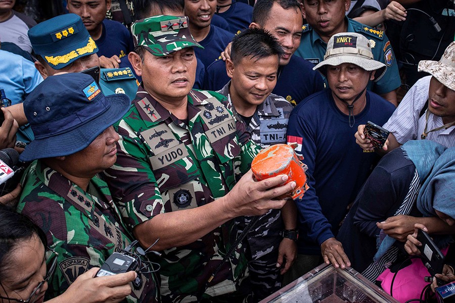 Indonesian navy commander Rear-Admiral Yudo Margono seen holding the cockpit voice recorder of the crash Lion Air JT610 in this Reuters file photo