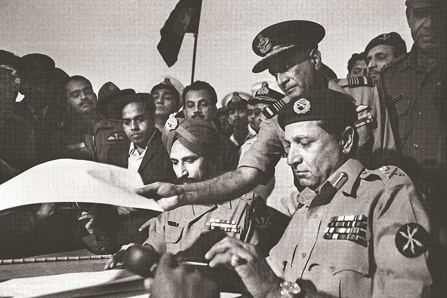 Lieutenant General AAK Niazi (right), commander of the Pakistan army in East Pakistan, receiving the Instrument of Surrender at the Race Course in Dhaka on December 16, 1971.