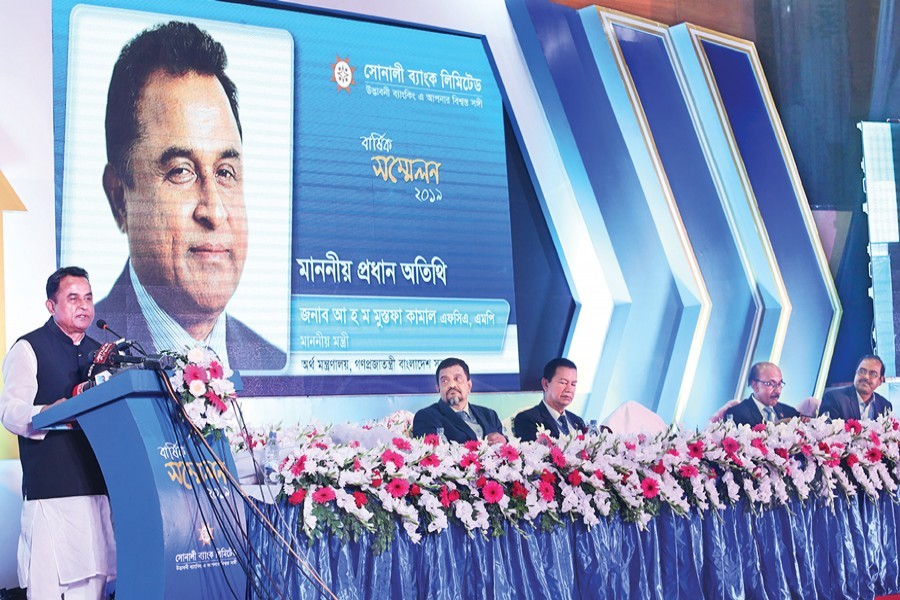 Finance Minister AHM Mustafa Kamal addressing the Annual Conference 2019 of Sonali Bank at the IDEB Bhaban in the city on Monday — FE Photo