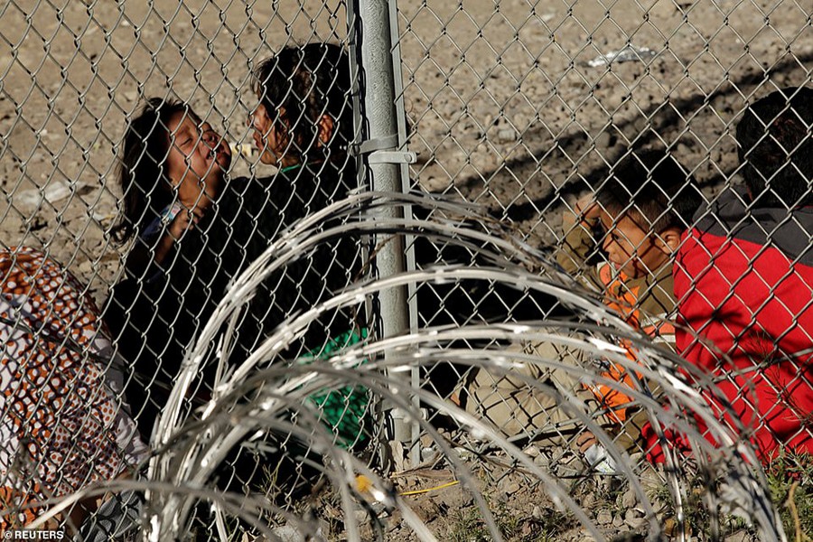 Central American migrants are seen inside an enclosure where they are being held by the US Customs and Border Protection (CBP), after crossing the border between Mexico and the United States illegally and turning themselves into request asylum, in El Paso, Texas on March 28, 2019 — Reuters photo