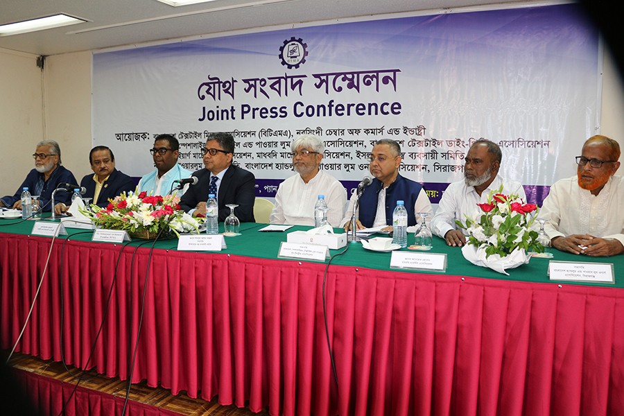 Speakers at a joint press conference organised by Bangladesh Textile Mills Association at a city hotel on Wednesday — Collected