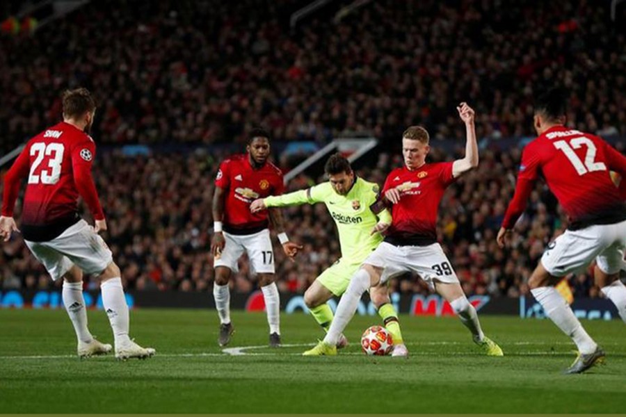 Manchester United's Scott McTominay in action with Barcelona's Lionel Messi — Reuters photo