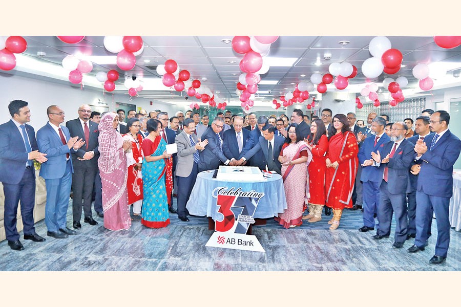 M Morshed Khan, Founder Chairman of AB Bank Limited, along with directors and Tarique Afzal, President & Managing Director (Current Charge) of the bank, cutting a cake at a programme marking the 37th founding anniversary of the bank at its head office in the city recently