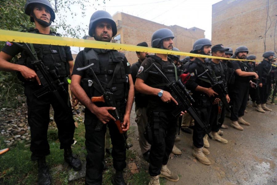 Pakistani security officials seen at the scene of a crime. (EPA Photo)