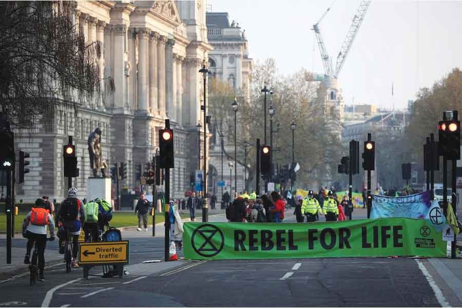 Climate change activists block Parliament Square during the Extinction Rebellion protest in London on April 17, 2019.  —Photo: Reuters