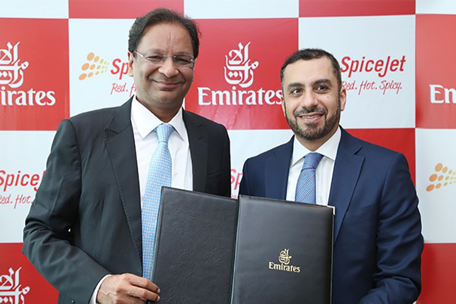 Adnan Kazim, Emirates’ Divisional Senior Vice President (right) and Ajay Singh, Chairman and Managing Director, SpiceJet pose for the camera after signing an MoU