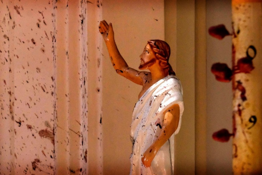 Out of all the images that have been widely circulated online, there is one particular image that has almost gained symbolic status. It is an image of the statue of Jesus, stained with blood, in the aftermath of the blast. - news18.com