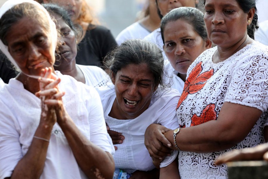 Mother of Shaini, 13, who died during a string of suicide bomb attacks on churches and luxury hotels on Easter Sunday, mourns at her funeral outside St Sebastian's Church in Negombo, Sri Lanka, April 24, 2019. Reuters