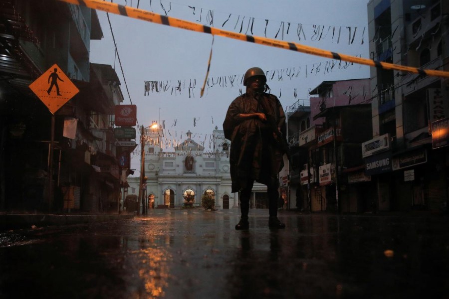 A soldier stands guard at St Anthony's Shrine during heavy rain, days after a string of suicide bomb attacks on churches and luxury hotels across the island on Easter Sunday, in Colombo, Sri Lanka, April 25, 2019. Reuters