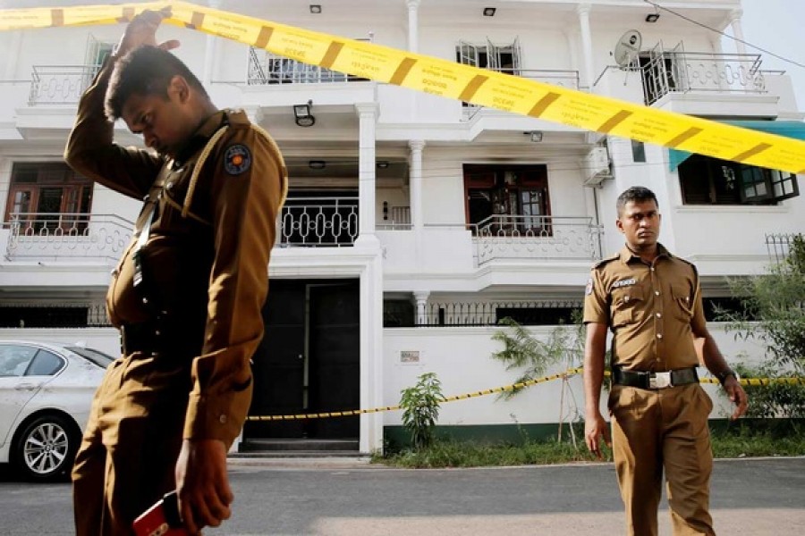 Police keep watch outside the family home of a bomber suspect where an explosion occurred during a Special Task Force raid, following a string of suicide attacks on churches and luxury hotels, in Colombo, Sri Lanka, April 25, 2019. Reuters