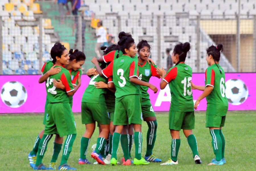 Bangladesh women's football team celebrating after beating Kyrgyzstan in the Bangamata U-19 Women's International Gold Cup Football at Bangabandhu National Stadium in the city on Friday	— bdnews24.com